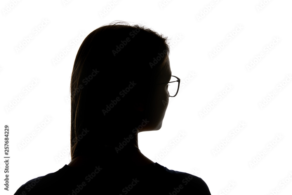 Silhouette of woman in glasses looking away isolated on white