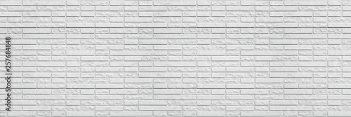 Abstract white brick wall texture background. Horizontal panoramic view of masonry brick wall for interior design.