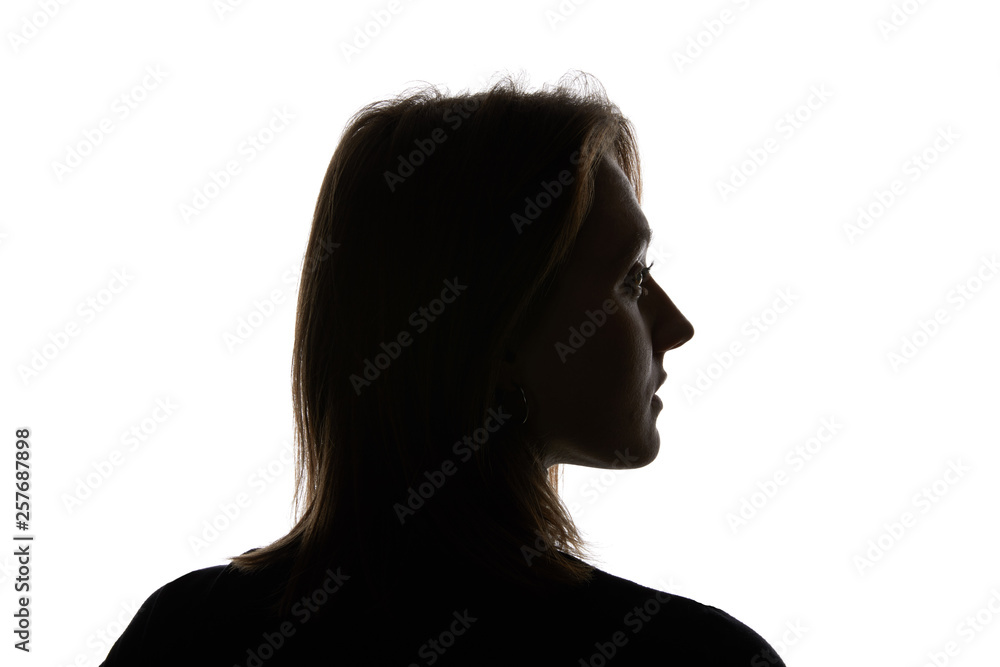Silhouette of young woman looking away isolated on white