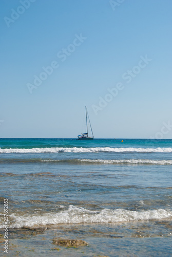 A sailboat with lowered sails