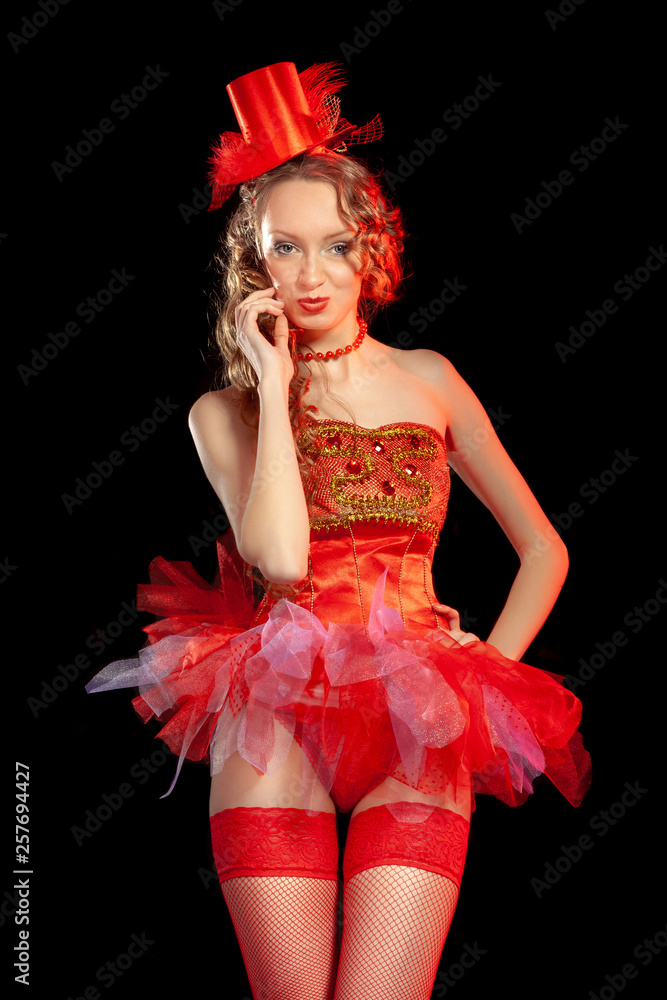 Fotka „Sexy burlesque dancer stripper posing in red corset and red hat with  curly hair and beautiful legs in red stockings“ ze služby Stock | Adobe  Stock