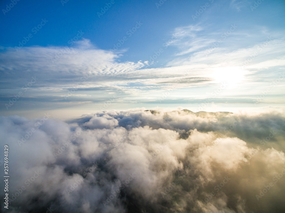 Obraz premium Wind power generator before sunrise sunset ，Wind power generation in the sea of clouds