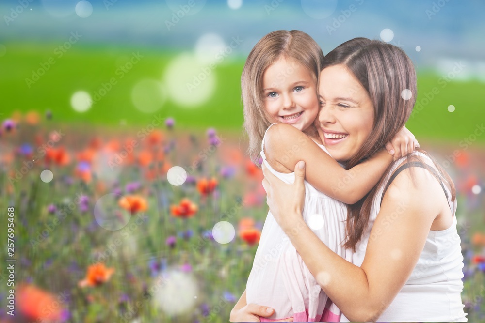 Happy Mother and daughter hugging Happy Mother and daughter hugging
