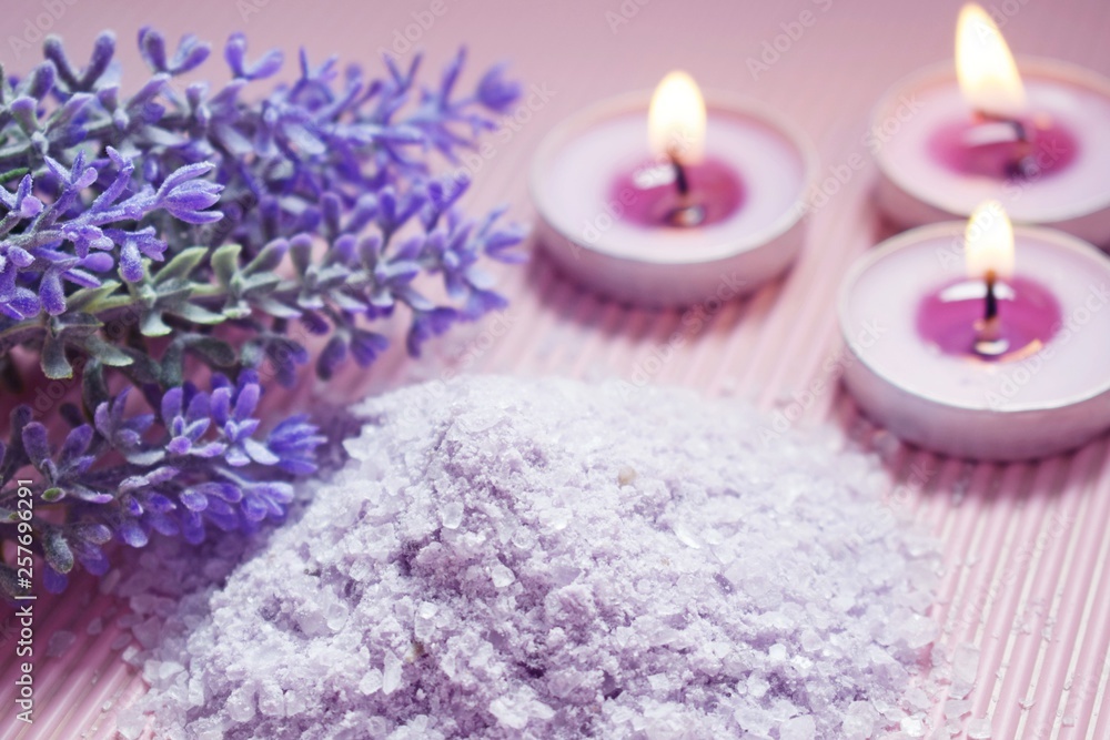 Bath salt with the scent of lavender on a pink background. Bath salt with the scent of lavender on a pink background.