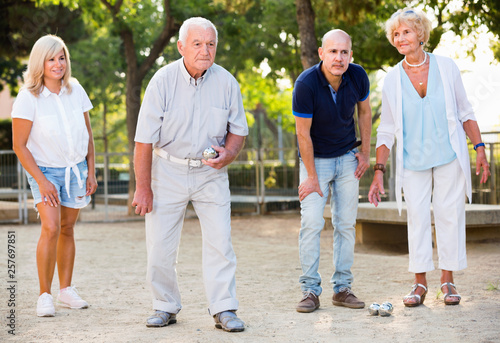 Happy family playing petanque in outdoor