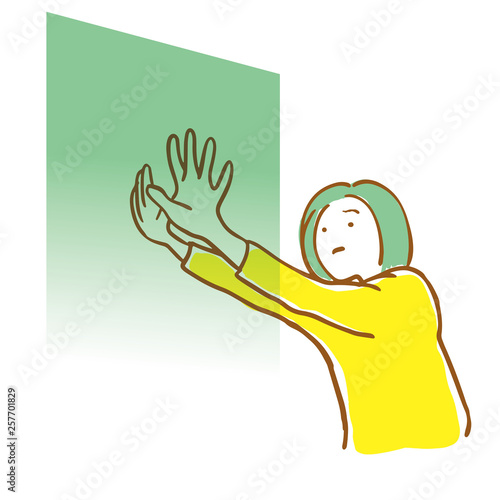壁を押す女性