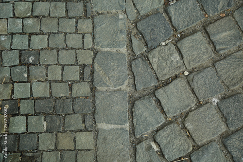 Cubic stone, cobblestone tile pavement. Abstract and decorative sidewalk top view.