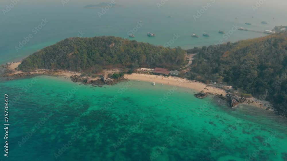 bird eye view boats sail along narrow sand coastline surrounded by green thick tropical forest and blue ocean bird eye view boats sail along narrow sand coastline surrounded by green thick tropical forest and blue ocean