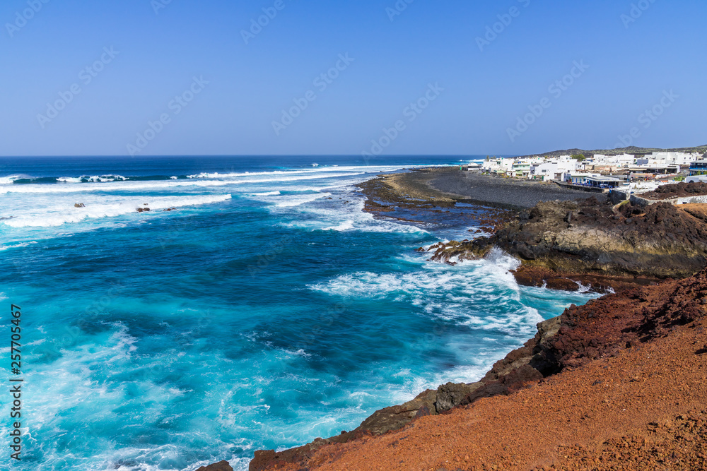 Spain, Lanzarote, Rough west coast waves at little fishing village of el golfo