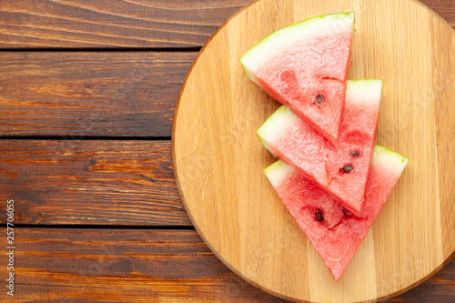 slices of fresh watermelon on a cutting board
