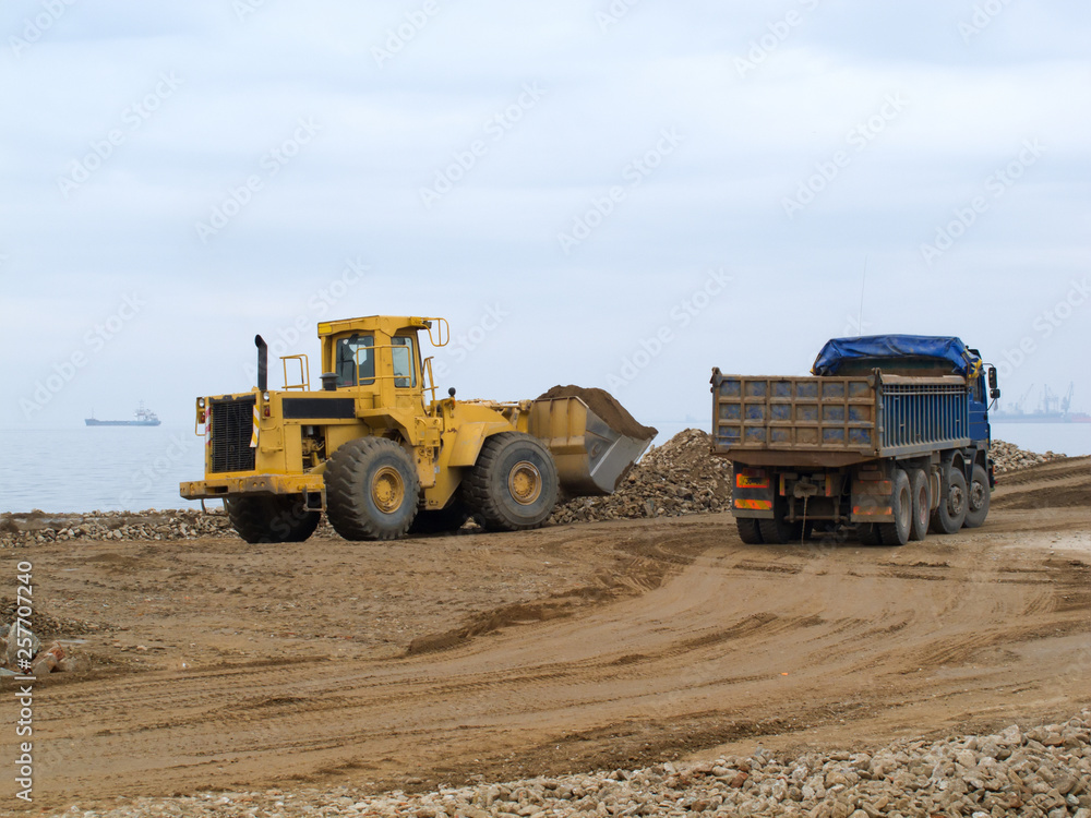 Obraz premium Construction excavator working in construction site