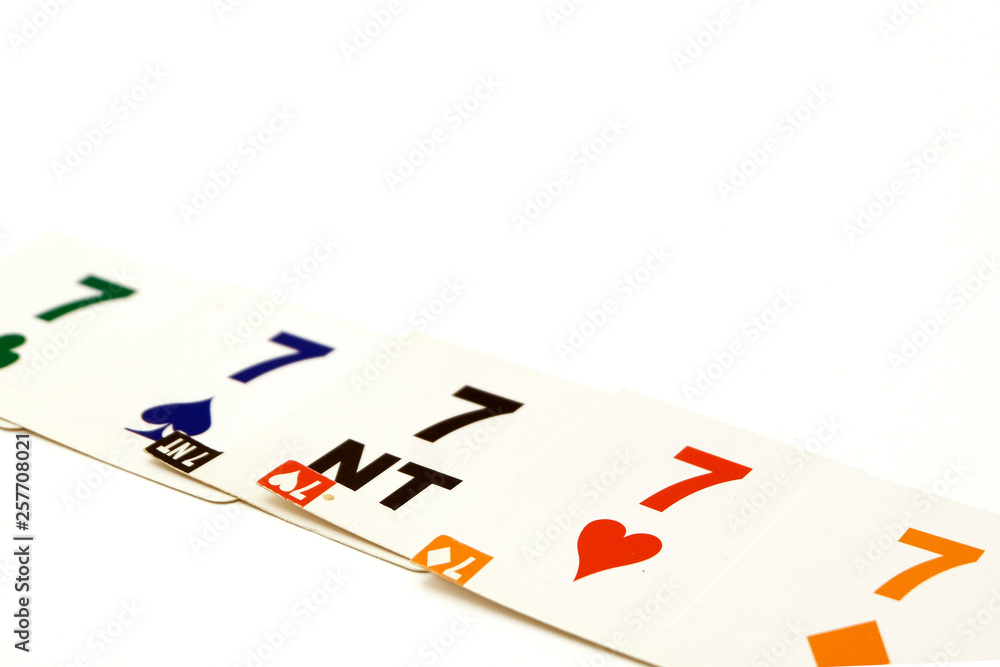 Bridge cards with 7 different suits on a white background. Equipment for a sports game of bridge. Betting concept.