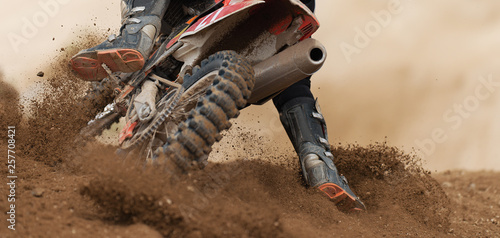 Obraz na plátně Rider driving in the motocross race the rear wheel motocross bike