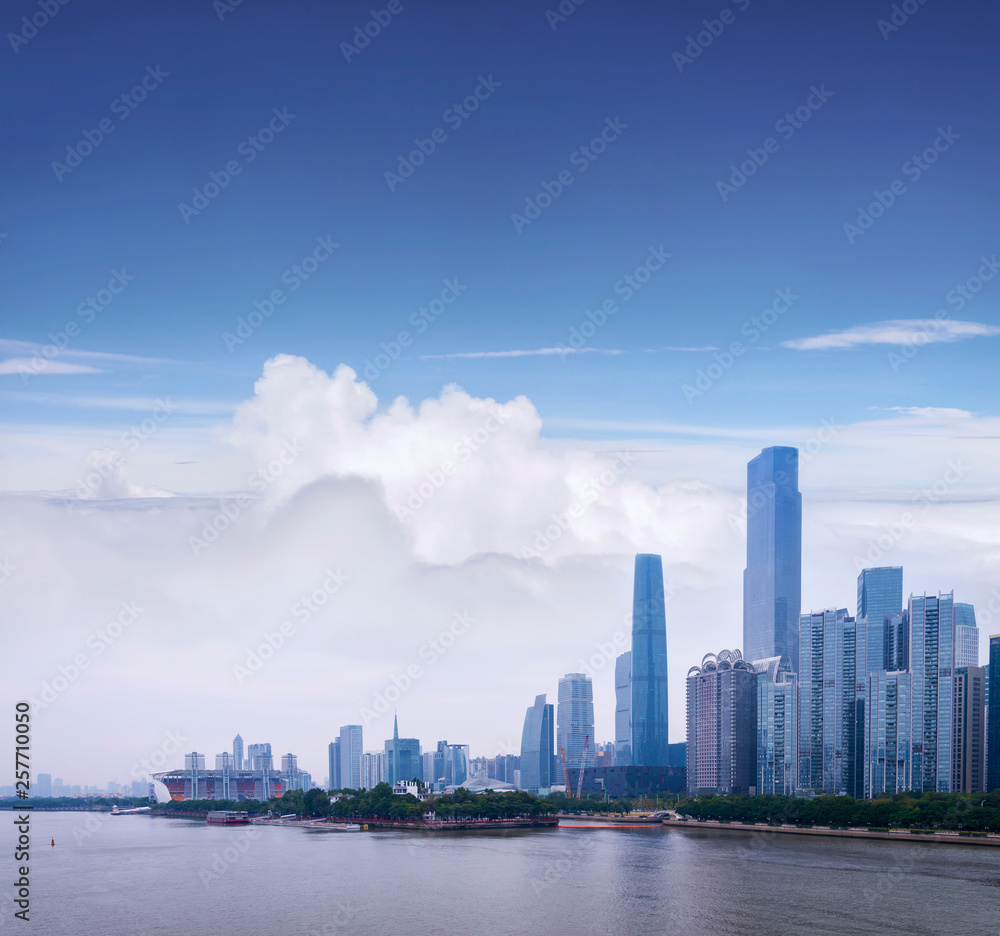 Cityscape of Guangzhou with skyscrapers and modern buildings in Zhujiang business center district, China.
