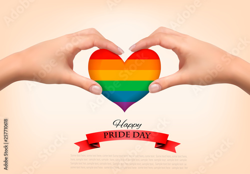 Rainbow heart shaped in hands. Gay pride concept. Vector illustration