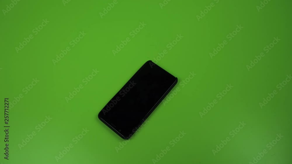 Falling, dropping smart phone. Green screen. Falling, dropping smart phone. Green screen.