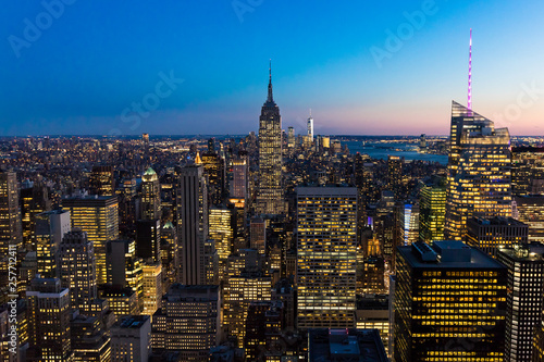 New York City Skyline in Manhattan downtown with Empire State Building and skyscrapers at night USA © Worawat