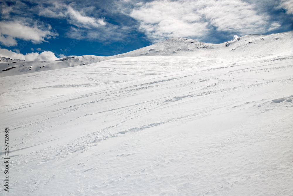 Winter panoramic view of a snowy mountain slope, of a mountain, in Switzerland.
