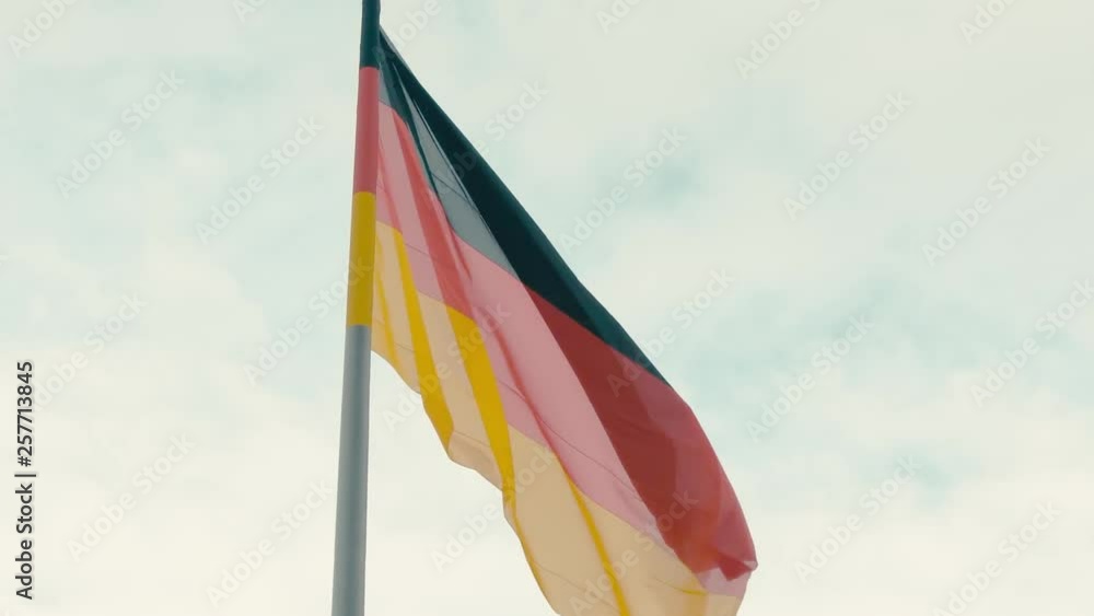 Slow Motion Flag of Germany against the blue turquoise sky. Slow Motion Flag of Germany against the blue turquoise sky.