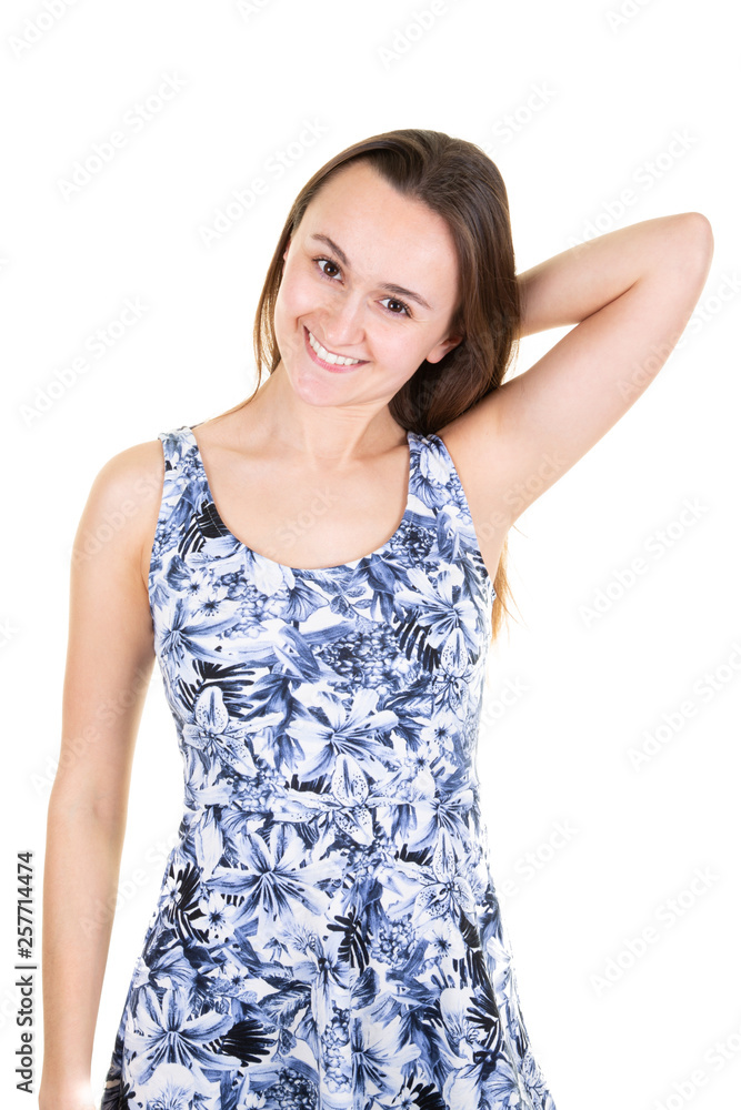 Happy woman smiling fashionable girl looking at the camera in flowers dress Happy woman smiling fashionable girl looking at the camera in flowers dress