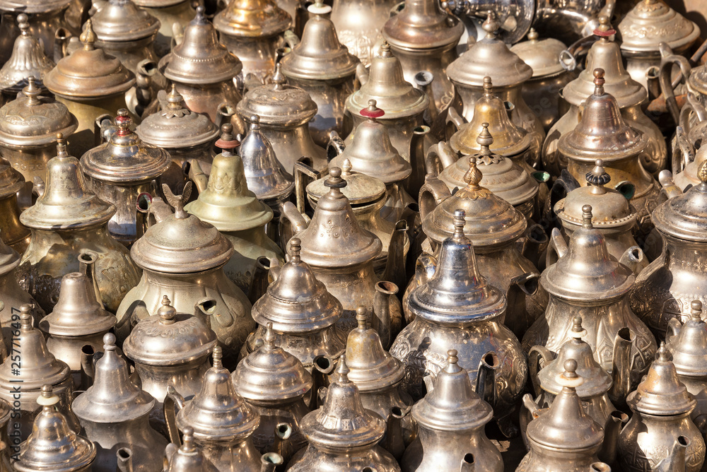 Traditional Arab kettles for tea for sale on the street market in Essaouira, Morocco Traditional Arab kettles for tea for sale on the street market in Essaouira, Morocco