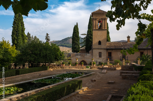 The formal gardens at Alhambra, Granada, Spain with the historic fort in the background