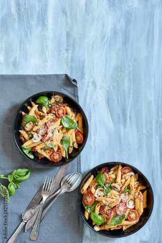 Pasta dish with tomato and mushoom sauce photo