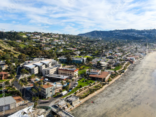 Aerial view of La Jolla coastline with nice small waves and beautiful villas in the background. La Jolla, San Diego, California, USA.  Beach with pacific ocean photo