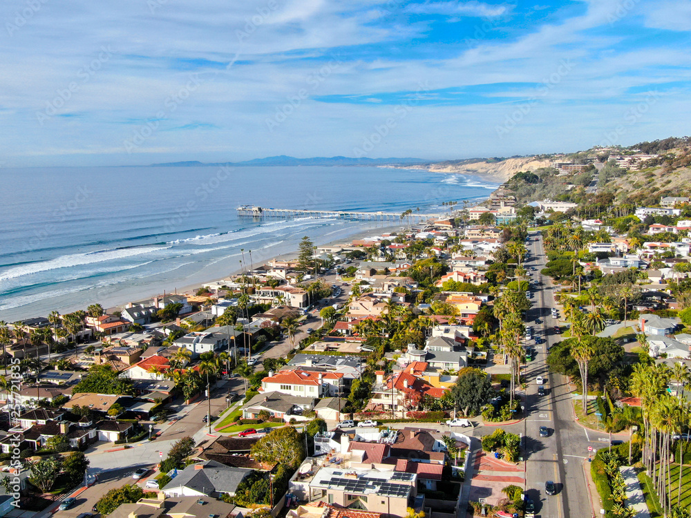 Aerial view of La Jolla coastline with nice small waves and beautiful villas in the background. La Jolla, San Diego, California, USA.  Beach with pacific ocean