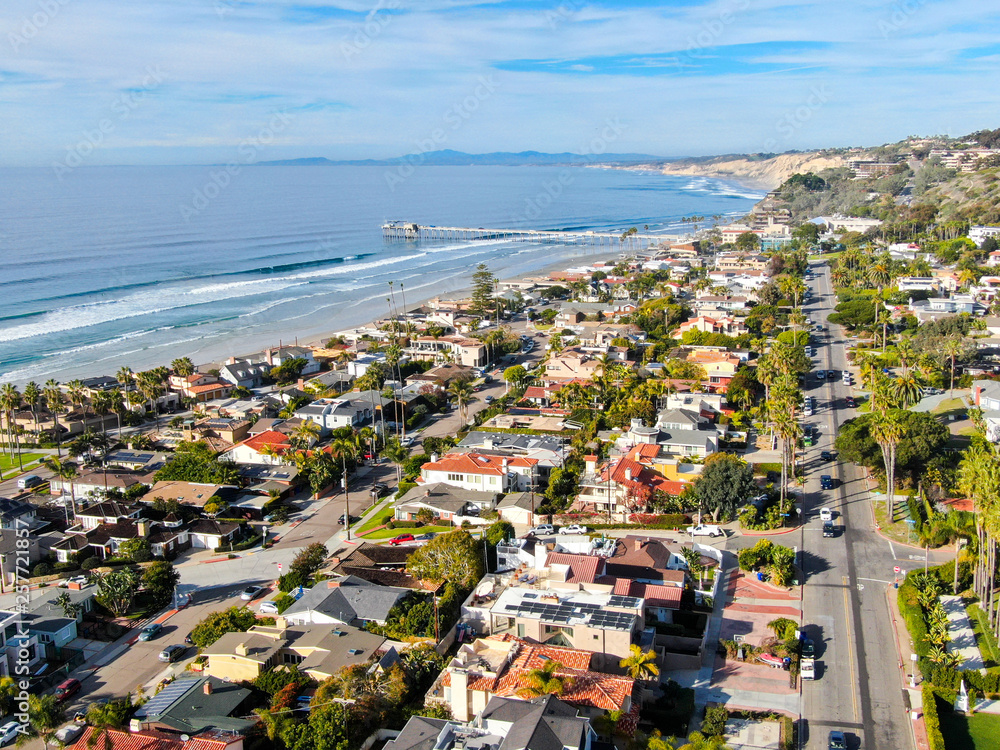 Aerial view of La Jolla coastline with nice small waves and beautiful villas in the background. La Jolla, San Diego, California, USA.  Beach with pacific ocean