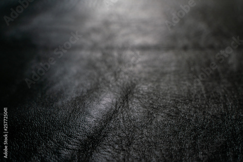 Black cow skin leather texture selective focus for put product