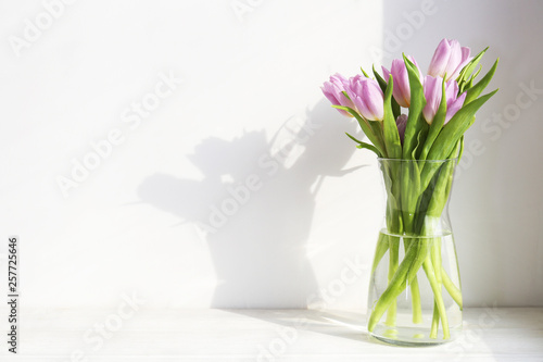 Multy purpose fresh flower composition  bouquet of purple tulips. International Women s day  mother s day greeting concept. Copy space  close up  top view  flat lay  background.