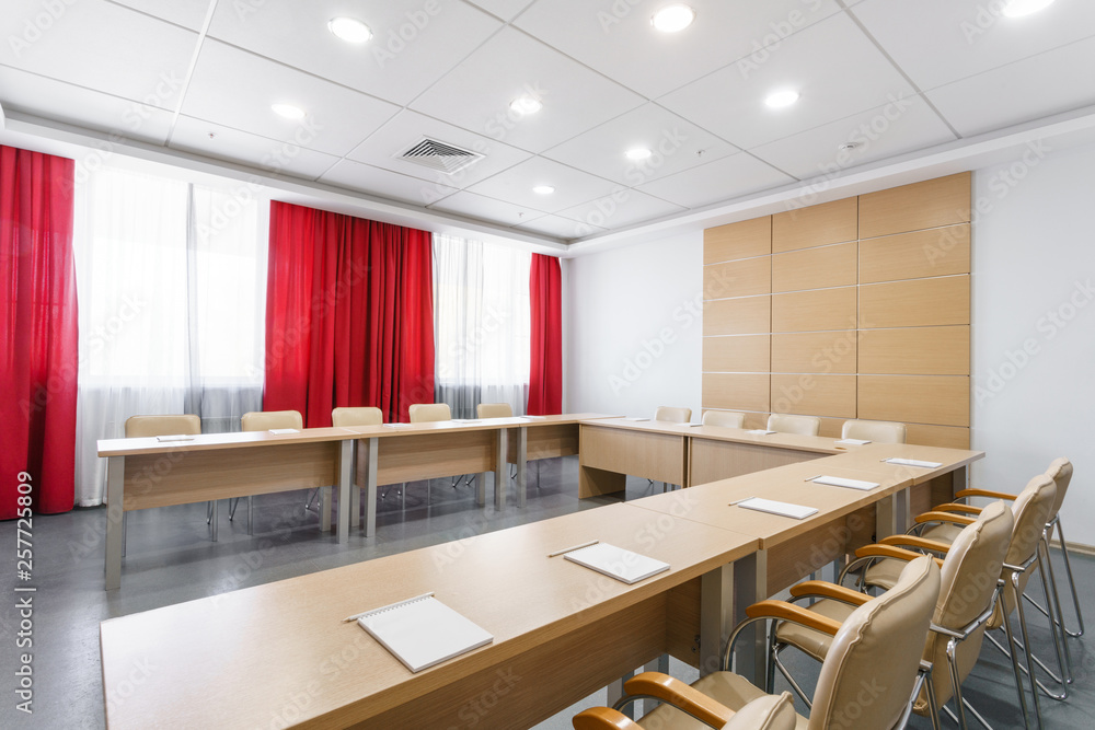 Empty modern conference hall in new hotel. Room for training, education, group classes, exams. Audience for Speakers at Business convention and Presentation. Empty modern conference hall in new hotel. Room for training, education, group classes, exams. Audience for Speakers at Business convention and Presentation.