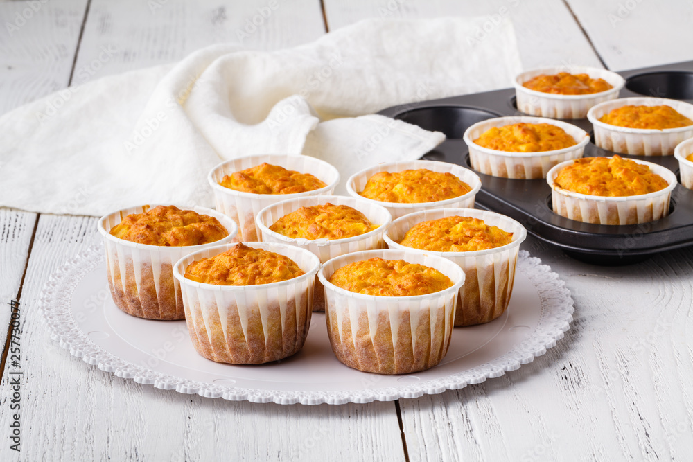 Pumpkin muffins with cream and candied fruits Pumpkin muffins with cream and candied fruits