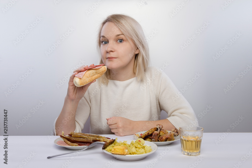 the girl is suffering from abdominal pain. Digestive problems, stomach pain, diarrhea, constipation, nausea. An improper diet. Girl eat unhealthy fatty food the girl is suffering from abdominal pain. Digestive problems, stomach pain, diarrhea, constipation, nausea. An improper diet. Girl eat unhealthy fatty food