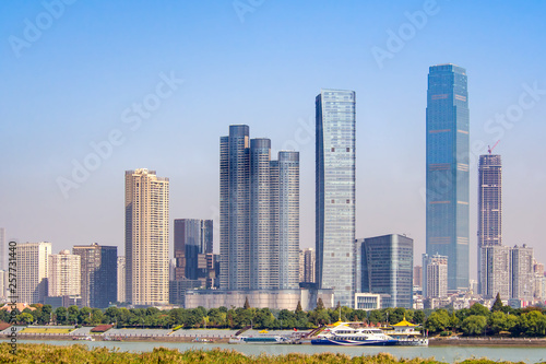Tall buildings in Changsha city, Hunan province of China, located at the bank of Xiang river. Chinese cityscape on a clear sunny day.