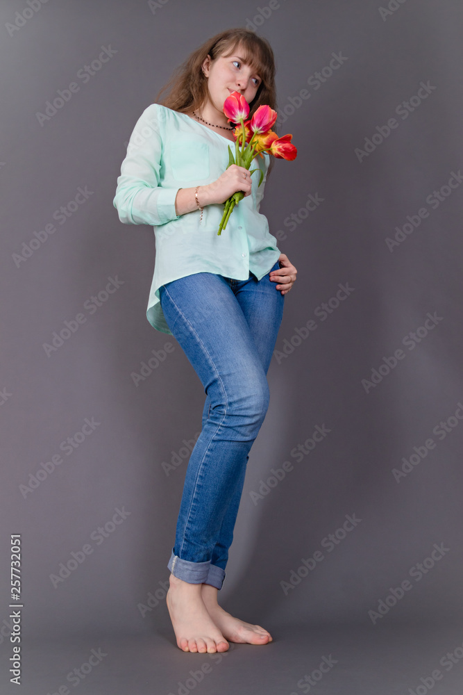 Attractive young girl with colourful tulips Attractive young girl with colourful tulips