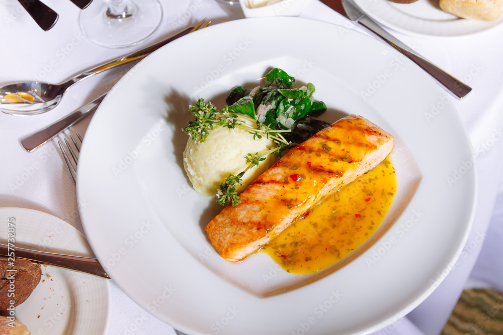 Grilled Salmon Steak with Spinach,Mash potato, souse Grilled Salmon Steak with Spinach,Mash potato, souse