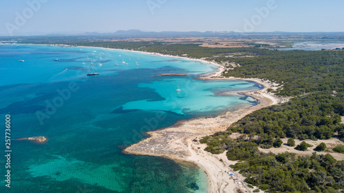 Colonia Sant Jordi, Spain. Amazing drone aerial landscape of the charming beaches Estanys and Es Trencs. Turquoise caribbean sea