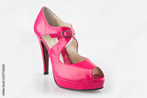woman high heel pink shoe isolated on white