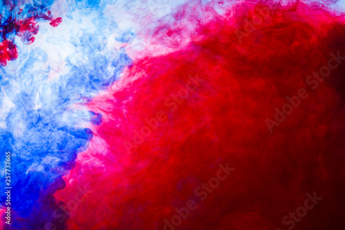 colored gouache paint in water, abstract colorful background