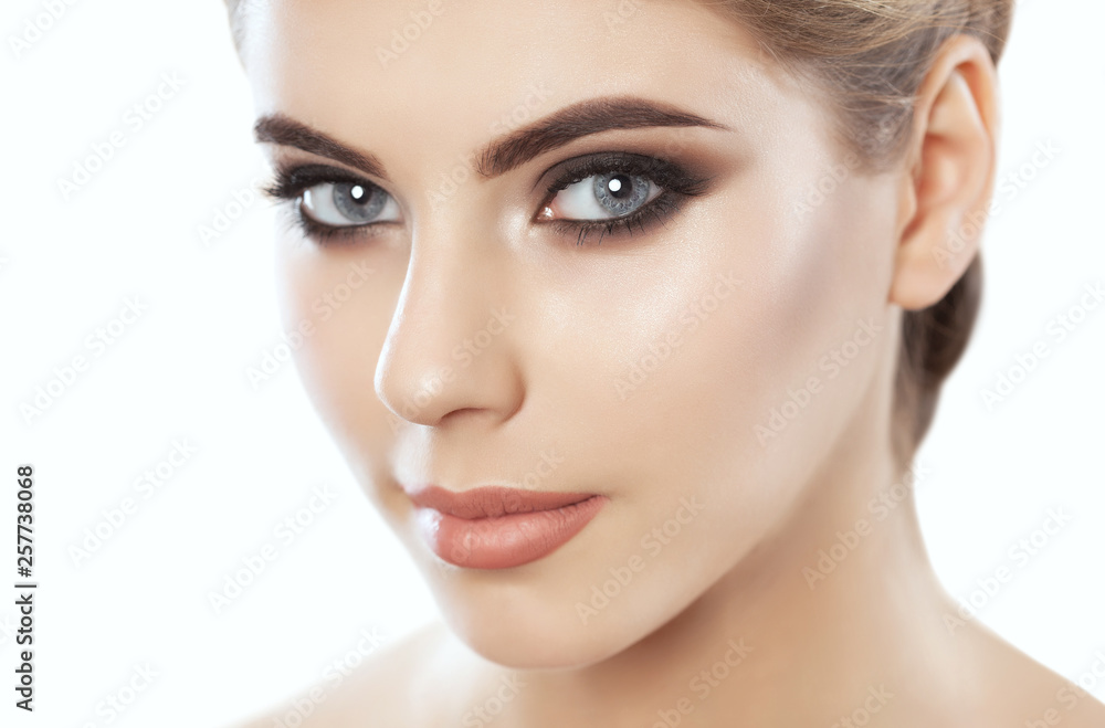 Portrait of a woman with beautiful make-up and hairstyle. Professional makeup and skin care. Portrait of a woman with beautiful make-up and hairstyle. Professional makeup and skin care.