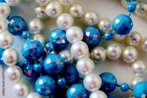 different colors beads on a white background
