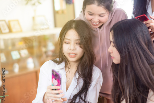 Group of business asian women discussion using smartphone