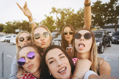 Six young beautiful girls looking at the camera and taking a selfie © teksomolika