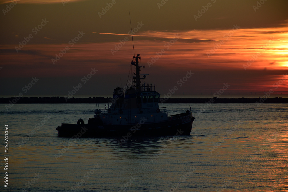 tugboat at sunset north pier the netherlands