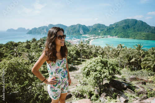 Koh Phi Phi Don, Viewpoint - Girl enjoying beautiful view of paradise bay from the top of the tropical island. View from the back. Thailand.