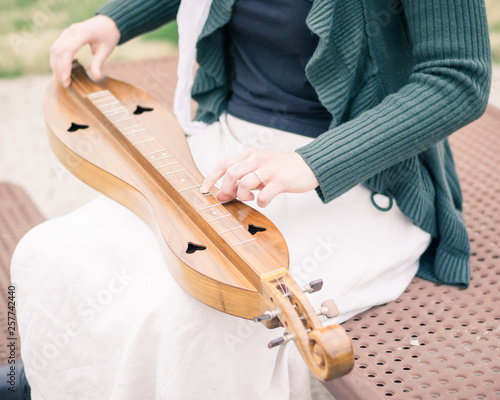  Girl Seated Playing Mountain Dulcimer