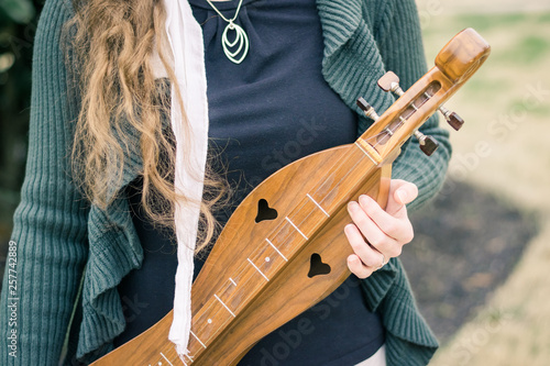 Girl Holding a Mountain Dulcimer