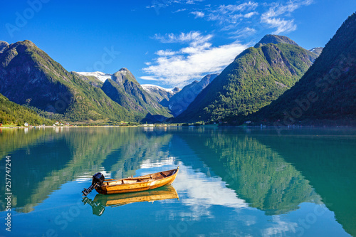 Beautiful Nature Norway natural landscape with fjord, boat and mountain. photo